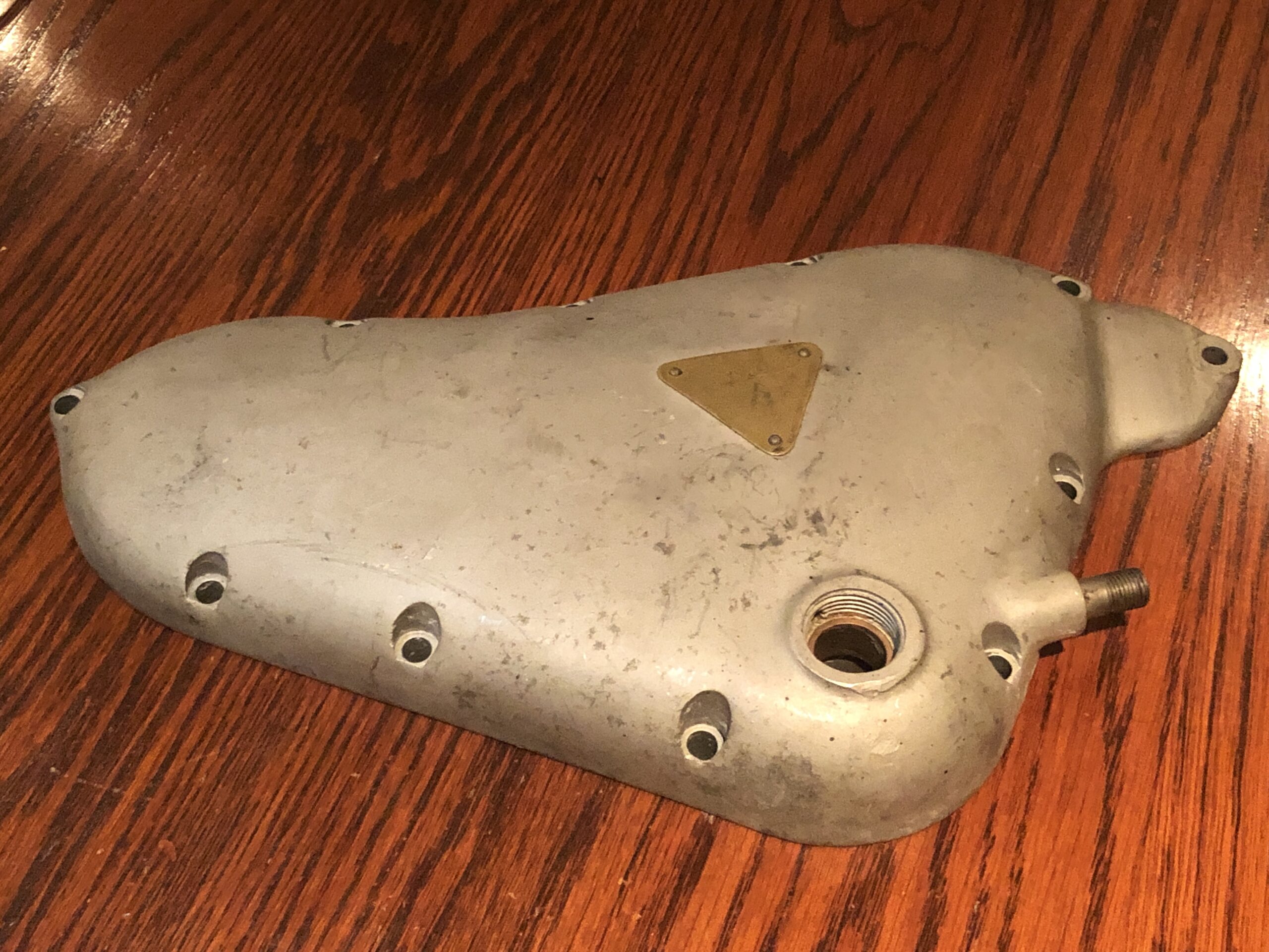 Pre Unit Triumph Timing Cover Tiger 100 500cc & 650 Twin dynamo type E2218. This outer timing covers has the Original Tiger 100 brass Badge. Suits 6T, TR6, TR5