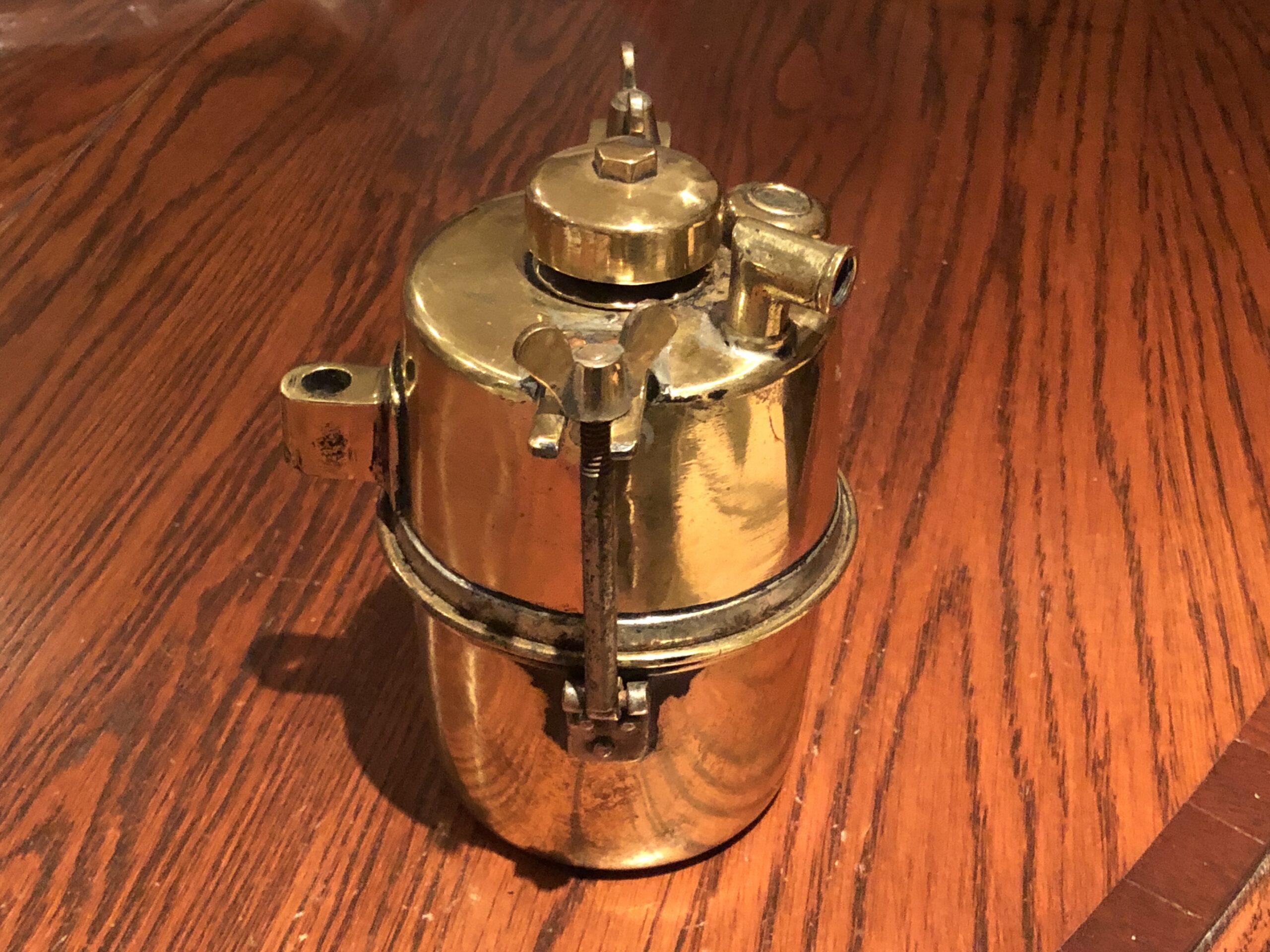 Very early motorcycle brass Carbide Acetylene gas generator. Vintage, veteran, pioneer and antique motorcycle acetylene gas powered carbide generator accessory