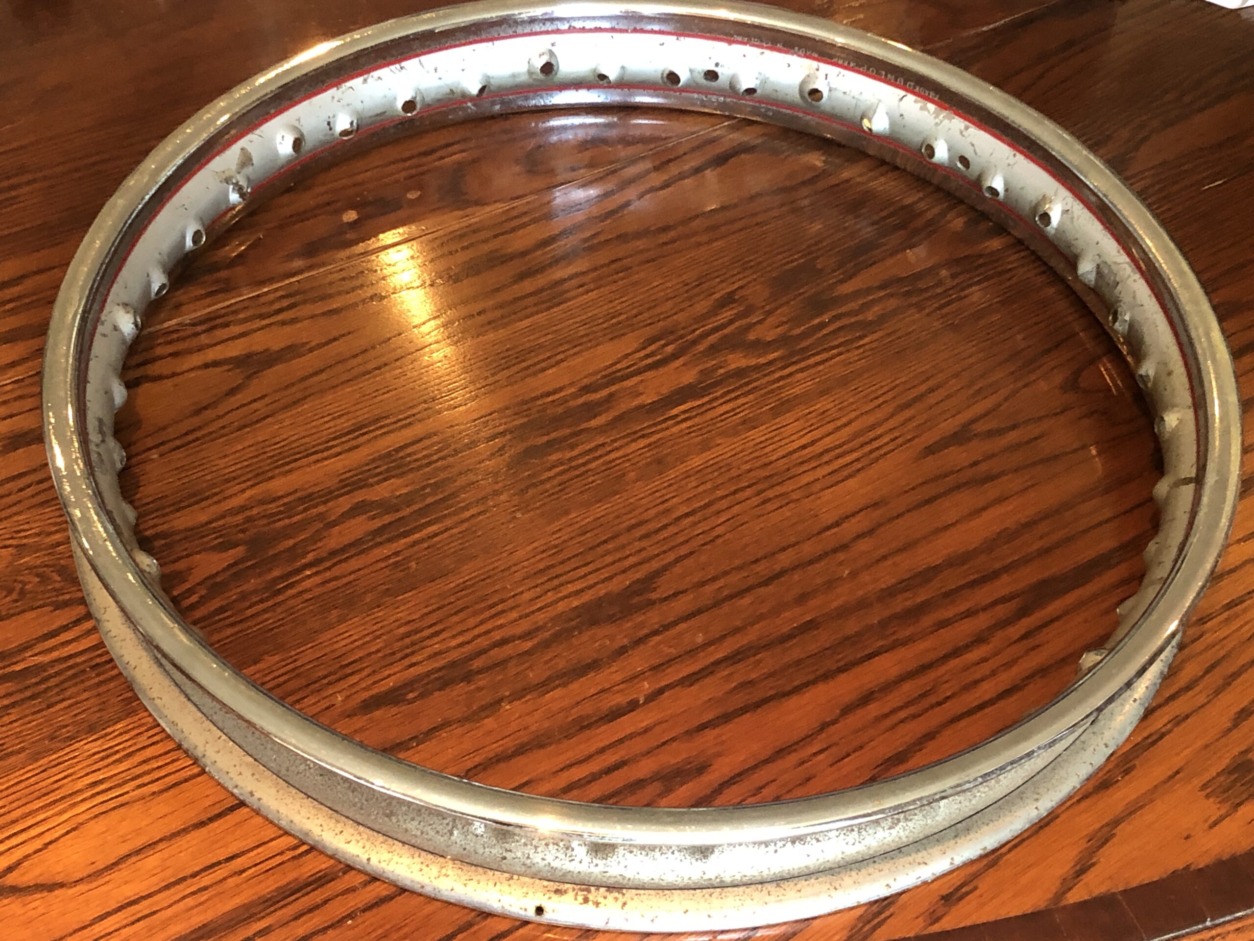 original Dunlop WM2-19 rim for a Norton motorcycle. Wheel rim MC289. 40 spoke holes. This original Dunlop WM2-19 is painted and chromed. Good for a patina bike