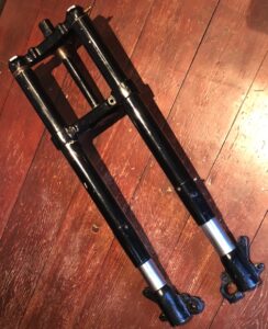 Velocette Dowty forks. I believe these Oleomatic air forks suit Velocette iron MAC, iron MSS and most late KSS. May use on Panther & some Scotts motorcycles